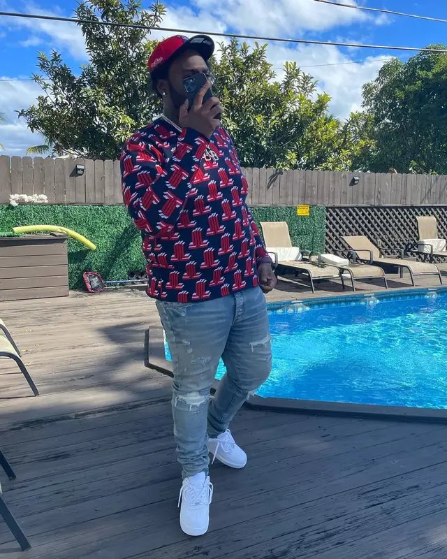 Peezy outfit in Lanvin, Amiri, and New Era, 2022