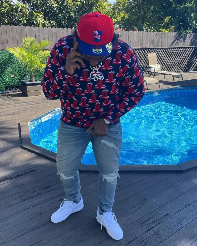 Peezy outfit in Lanvin, Amiri, and New Era, 2022
