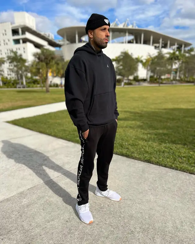 Nicky Jam outfit in Jordan, Moncler, and Adidas, 2022