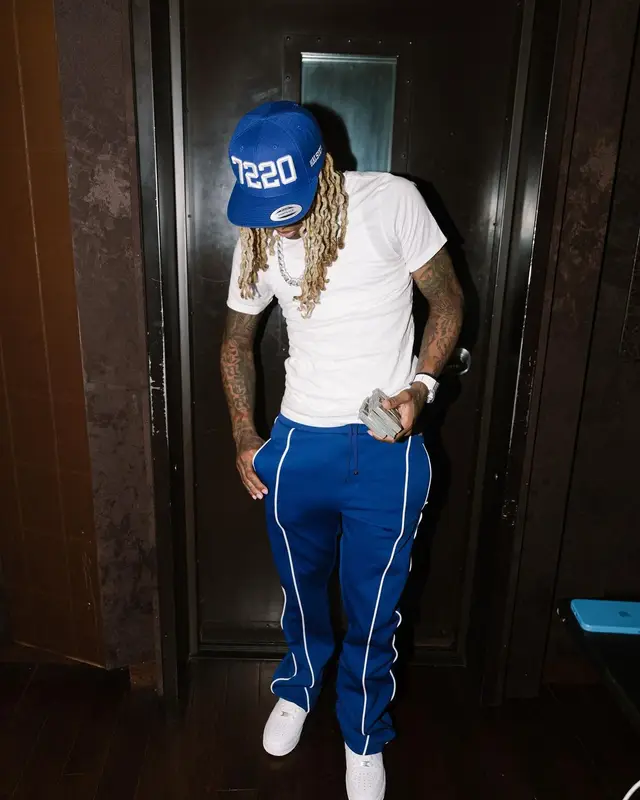 Lil Durk outfit in Louis Vuitton, Hanes, and Amiri, 2022
