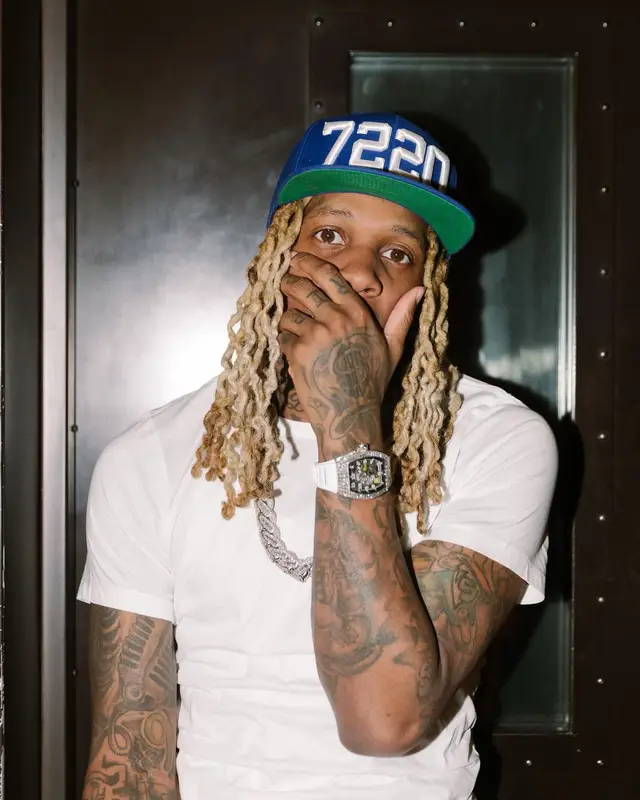Lil Durk outfit in Louis Vuitton, Hanes, and Amiri, 2022