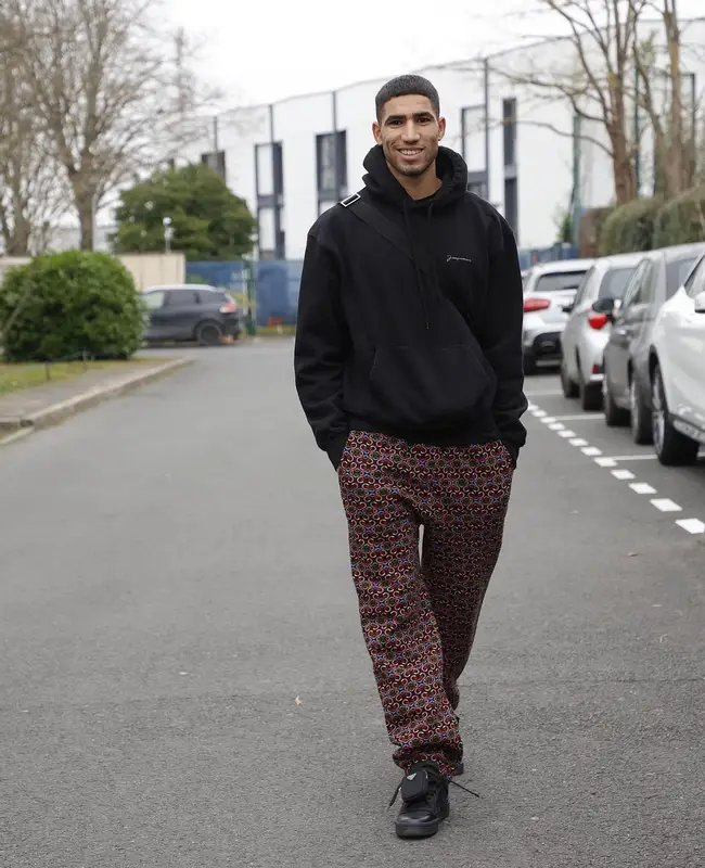 Achraf Hakimi outfit in Jacquemus, Benetton, and Prada, 2022