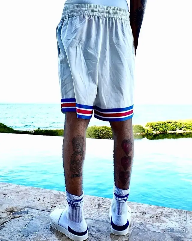 Bizzy Banks outfit in Louis Vuitton, NBA, and Amiri, 2021