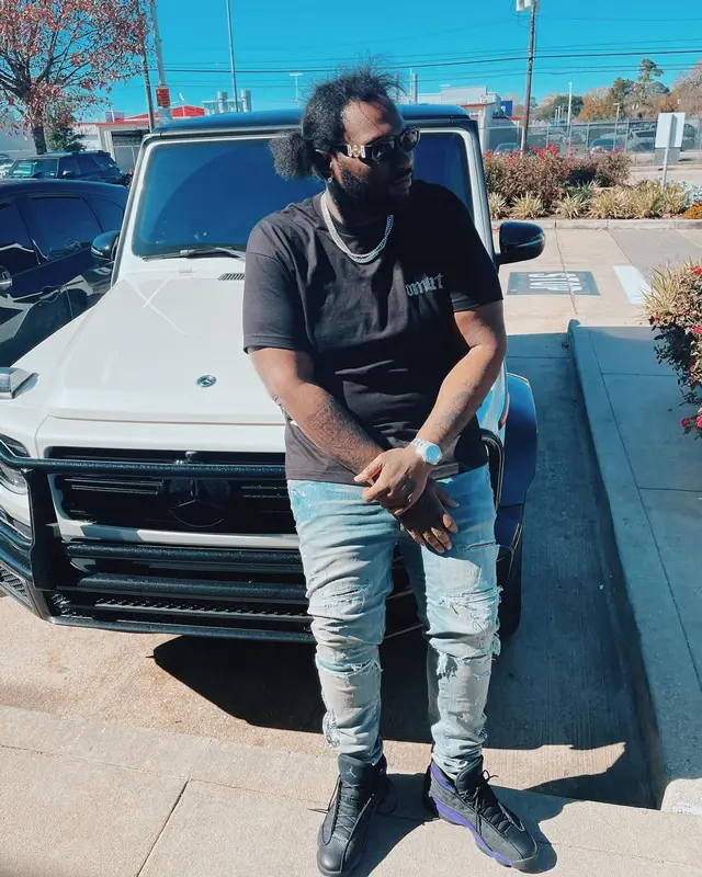 Peezy outfit in Amiri, Jordan, and Versace, 2022