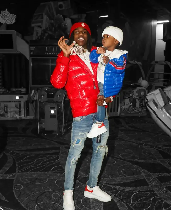 Polo G outfit in Purple Brand, Alexander McQueen, and Moncler, 2022