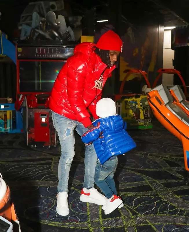 Polo G outfit in Purple Brand, Alexander McQueen, and Moncler, 2022