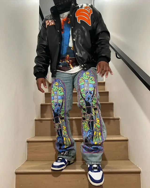 Strick outfit in Who Decides War, Nike, and Ambush, 2022