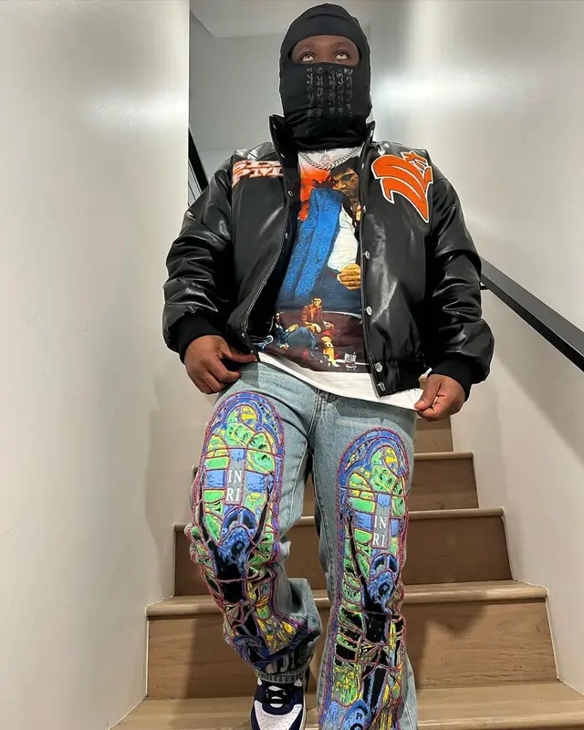 Strick outfit in Who Decides War, Nike, and Ambush, 2022