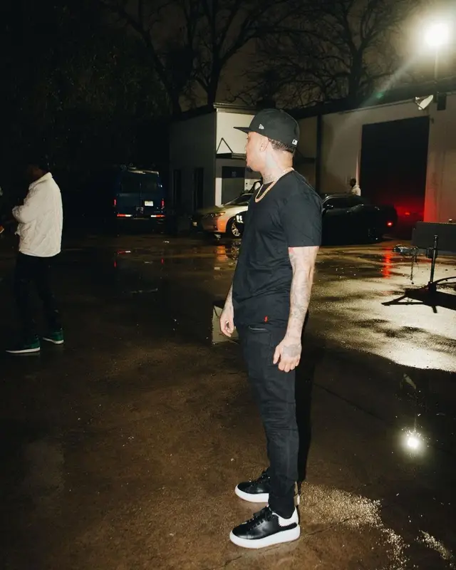 Kirko Bangz outfit in Polo Ralph Lauren, Alexander McQueen, and New Era, 2022