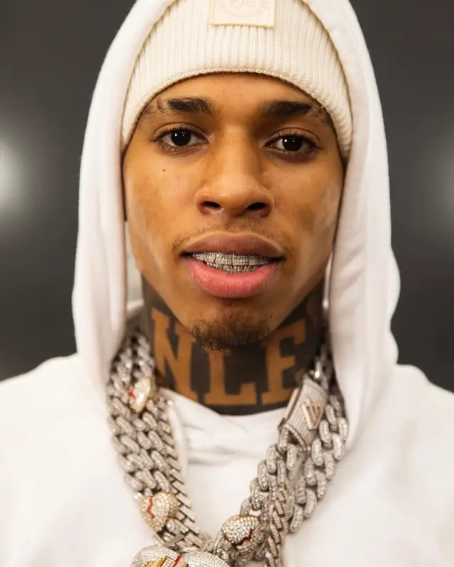 NLE Choppa outfit in Balmain, Monfrere, and Moose Knuckles, 2022