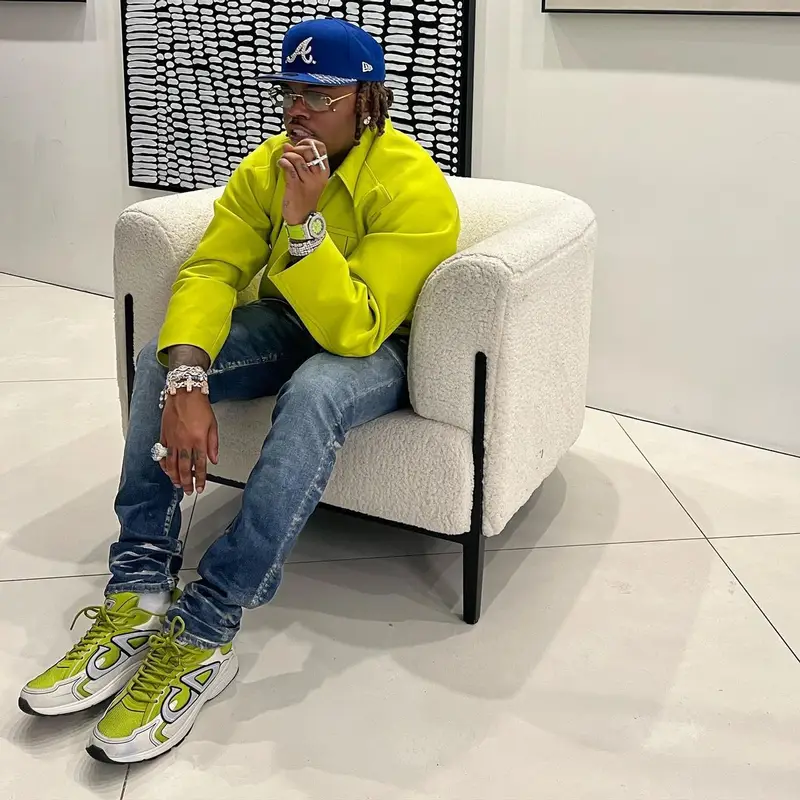 Gunna outfit in Bottega Veneta, Purple Brand, and Dior, 2022