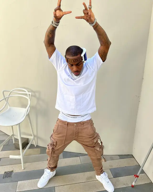DaBaby outfit in Balenciaga, Amiri, and Louis Vuitton, 2022