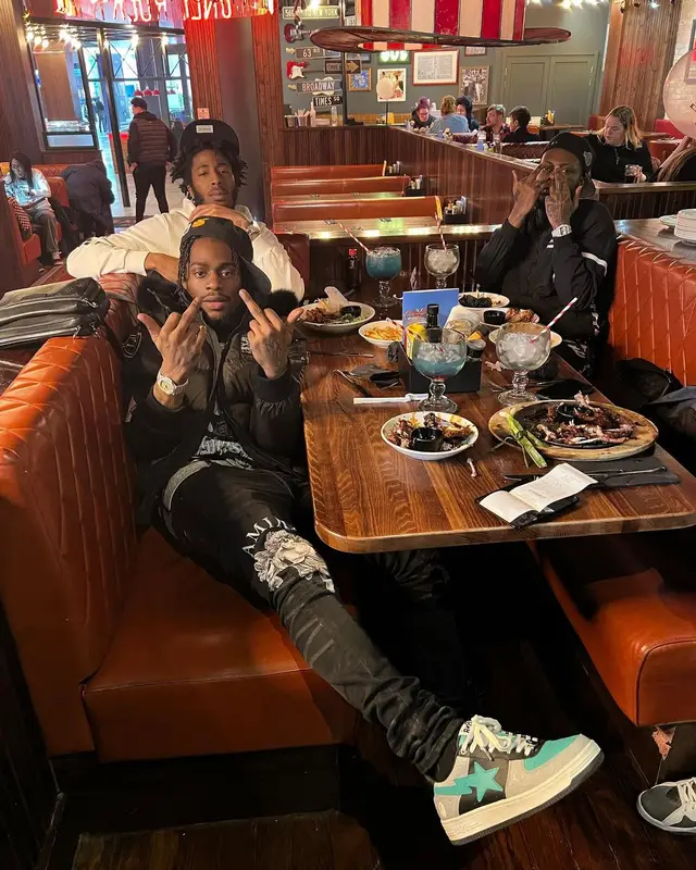 Russ Millions outfit in Moose Knuckles, Louis Vuitton, and Amiri, 2022