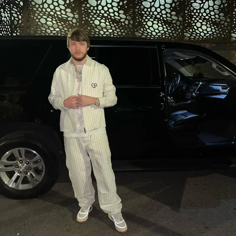 Murda Beatz outfit in Dior, Nike, and Travis Scott Merch, 2022