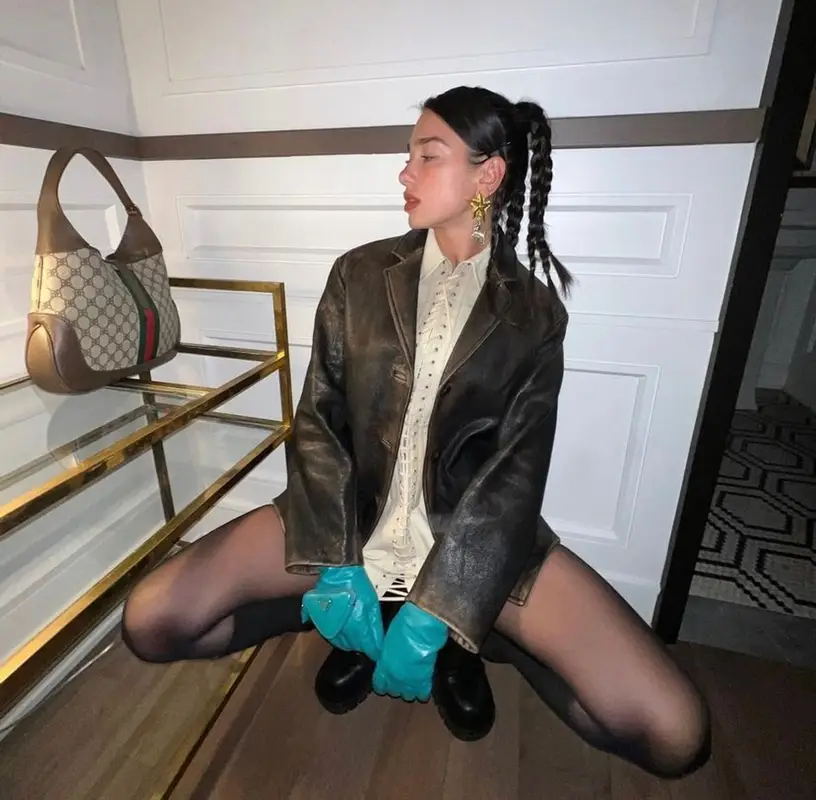 Dua Lipa outfit in Prada, Bottega Veneta, and Gucci, 2022