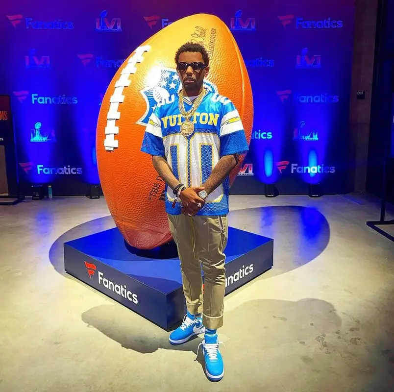 Fabolous outfit in Louis Vuitton, Rhude, and Nike, 2022