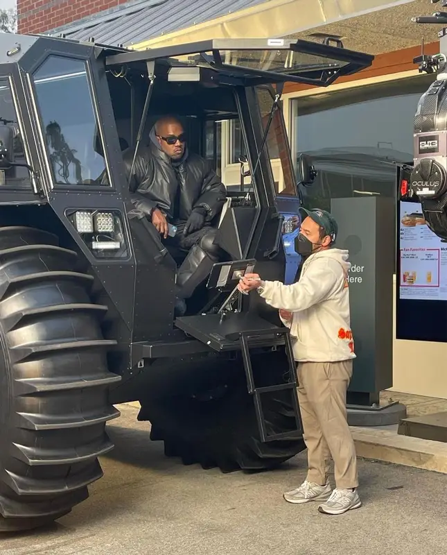 Kanye West outfit in Yeezy, GAP, and Illesteva, 2022