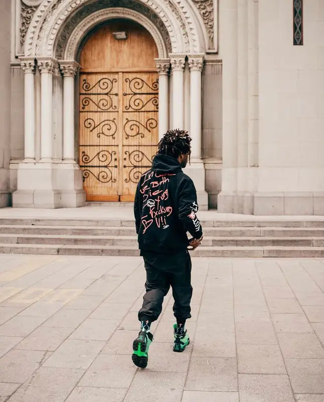 Saint JHN outfit in Christian Sex Club, Pyer Moss, and Louis Vuitton, 2022