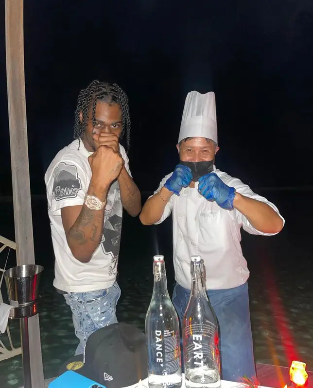 Russ Millions outfit in Louis Vuitton, Amiri, and Nike, 2022