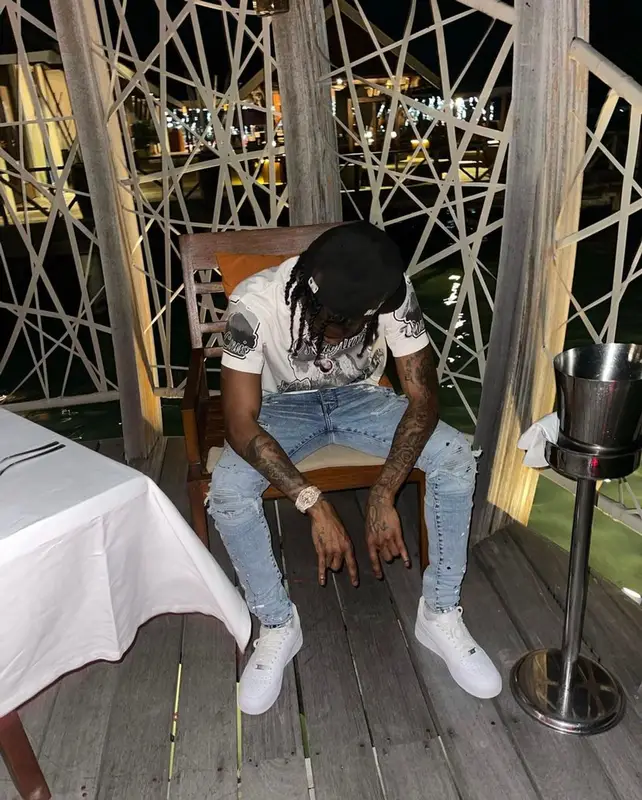 Russ Millions outfit in Louis Vuitton, Amiri, and Nike, 2022