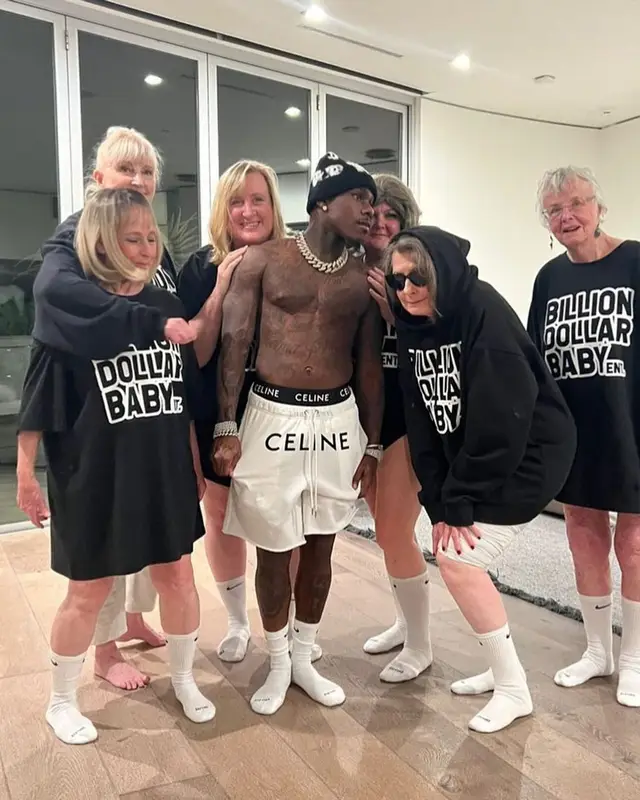 DaBaby outfit in Celine, Nike, and Drake Merch, 2022