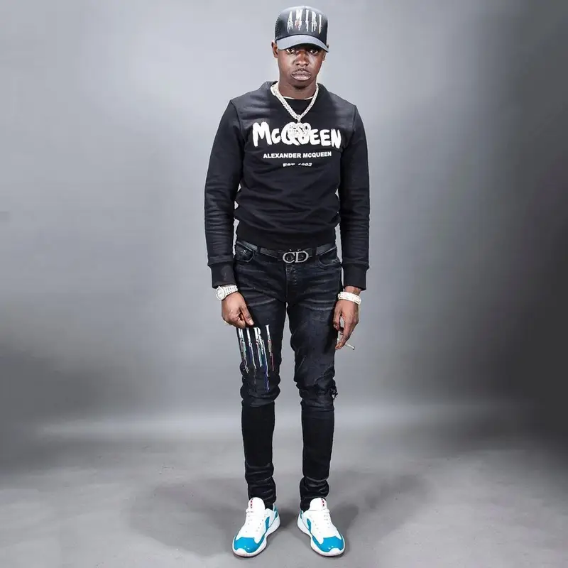 Bobby Shmurda outfit in Alexander McQueen, Dior, and Amiri, 2022