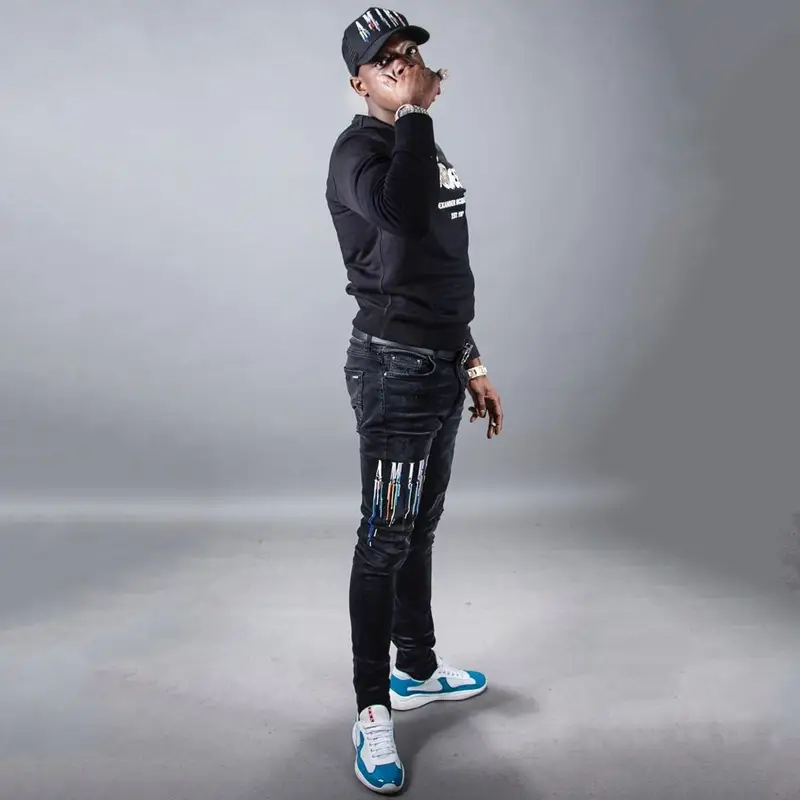 Bobby Shmurda outfit in Alexander McQueen, Dior, and Amiri, 2022