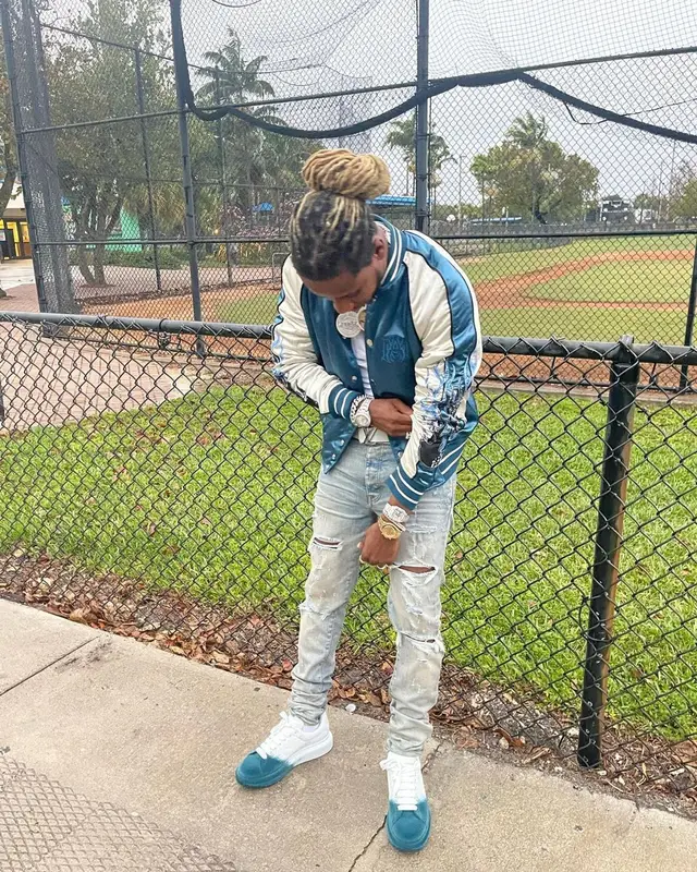100k Track outfit in Amiri, Louis Vuitton, and Versace, 2022