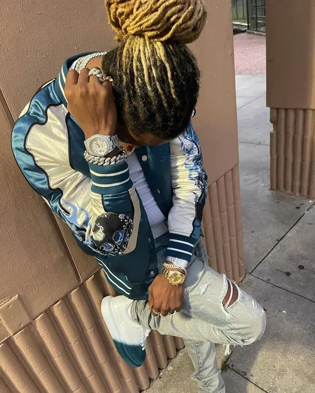 100k Track outfit in Amiri, Louis Vuitton, and Versace, 2022