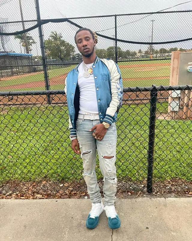 100k Track outfit in Amiri, Louis Vuitton, and Versace, 2022