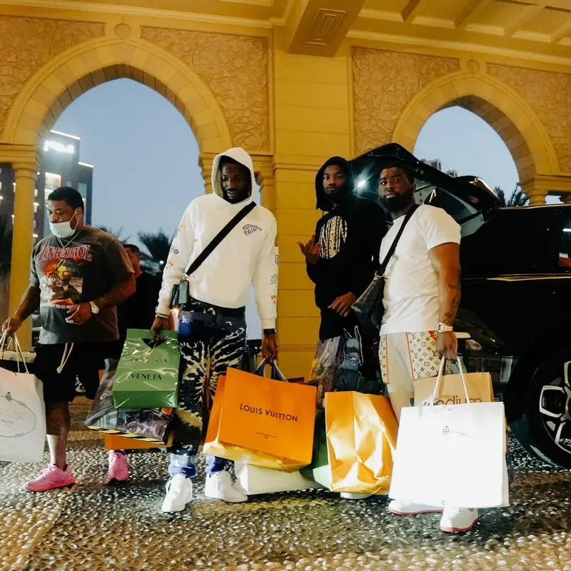 Meek Mill outfit in Amiri, Nike, and Louis Vuitton, 2022
