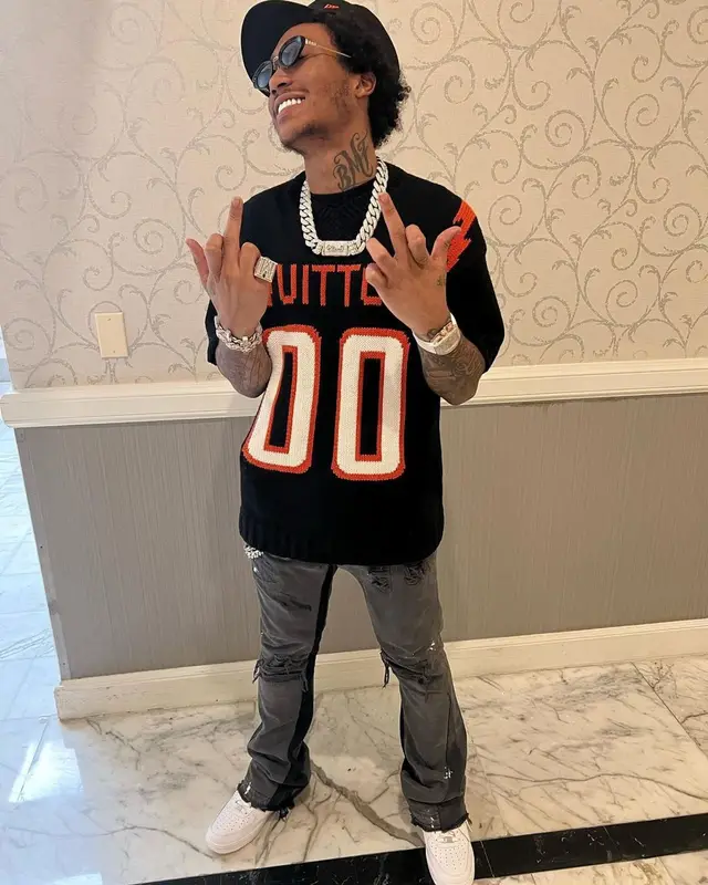 Lil Meech outfit in Louis Vuitton, Gallery Dept., and New Era, 2022
