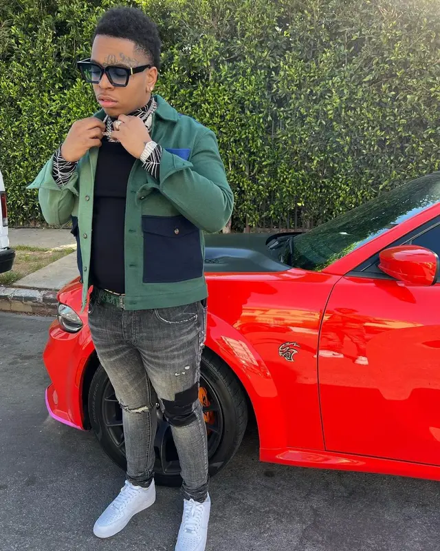 Lil Gotit outfit in Zara, Purple Brand, and Dior, 2022