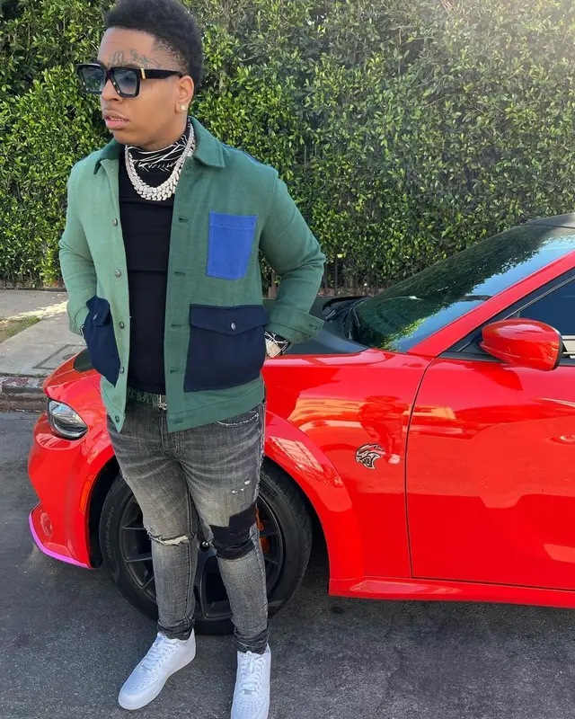 Lil Gotit outfit in Zara, Purple Brand, and Dior, 2022