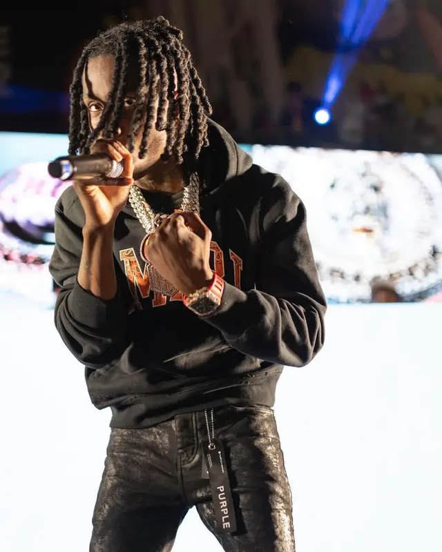 Polo G outfit in Amiri, Purple Brand, and Nike, 2022