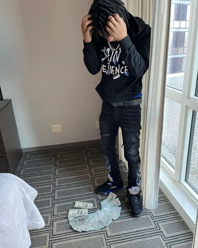 B Lovee outfit in Amiri, Jordan, and Louis Vuitton, 2022