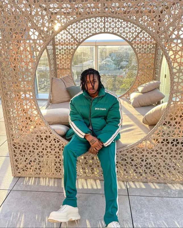 DDG outfit in Moncler, Alexander McQueen, and Palm Angels, 2022