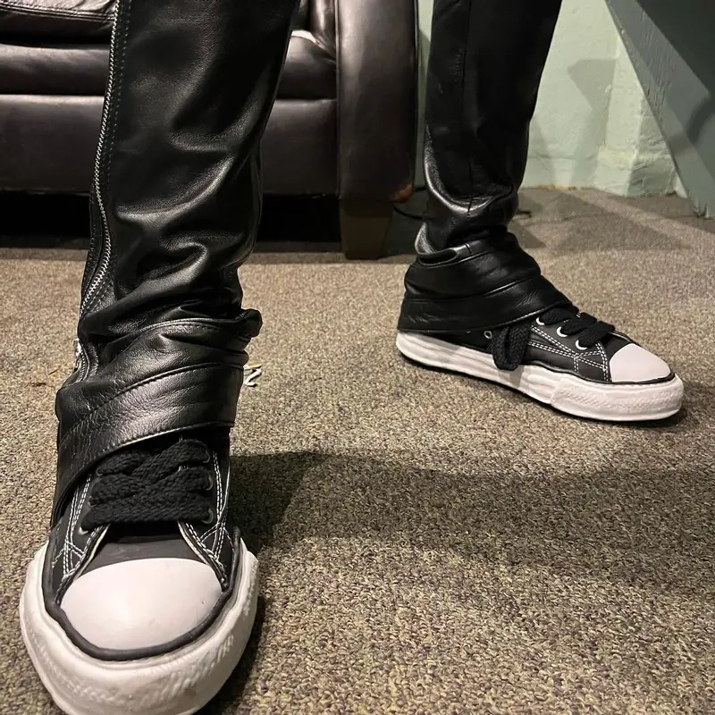 PnB Rock outfit in Cease±Desist, Maison Mihara Yasuhiro, and Balenciaga, 2022