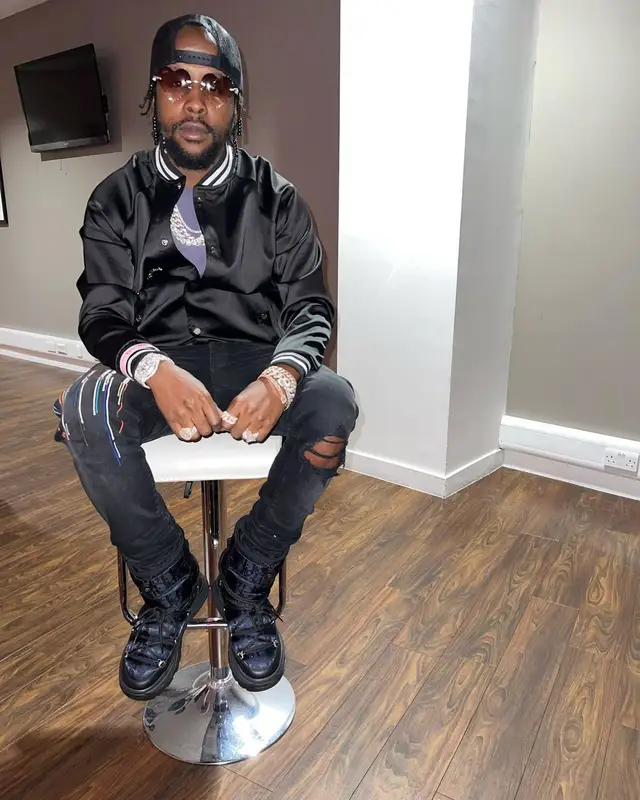 Popcaan outfit in Amiri and Dior, 2022