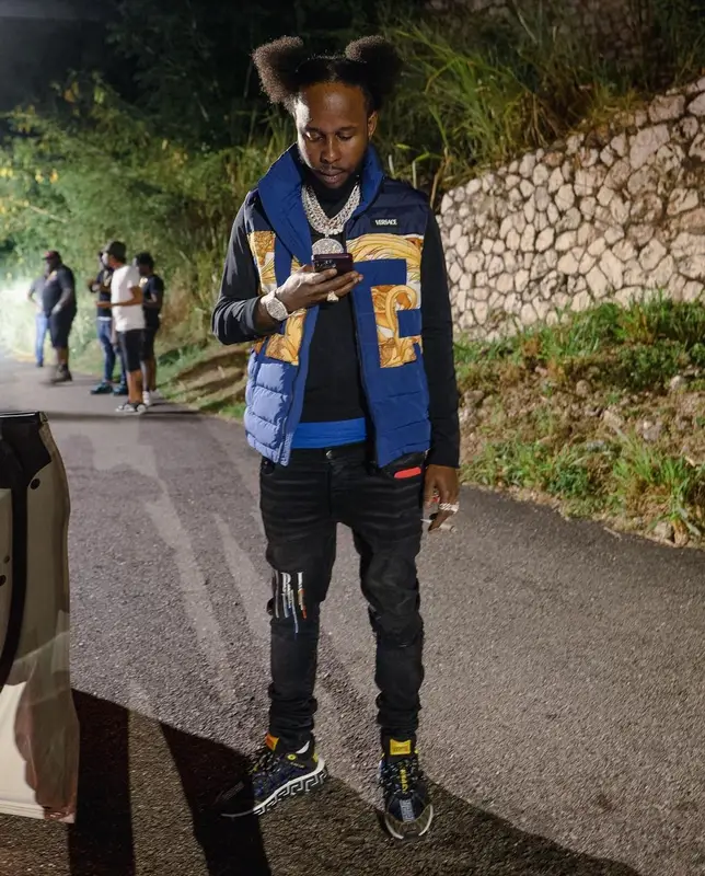 Popcaan outfit in Versace and Amiri, 2022