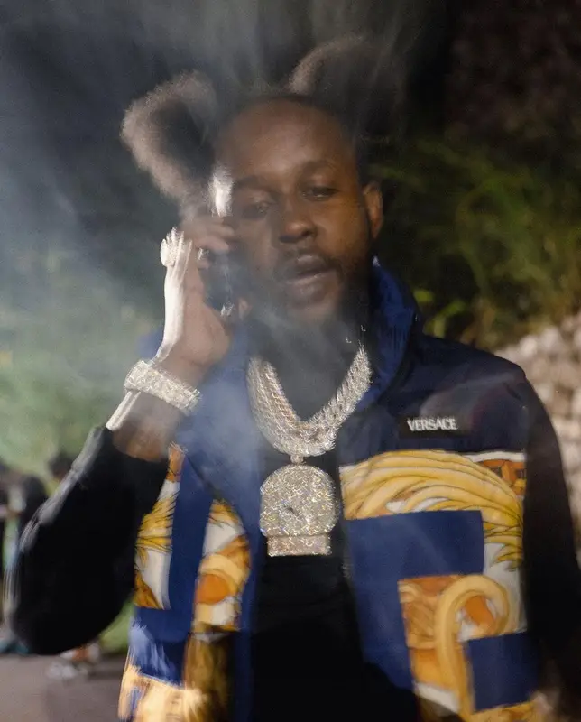 Popcaan outfit in Versace and Amiri, 2022