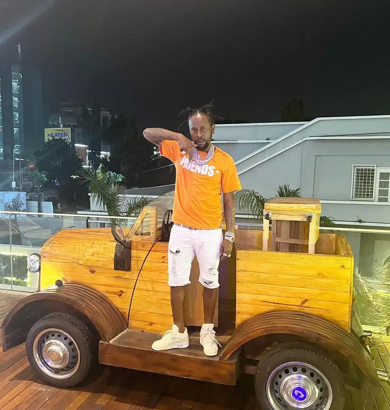 Popcaan outfit in Vlone, Jordan, and Burberry, 2022