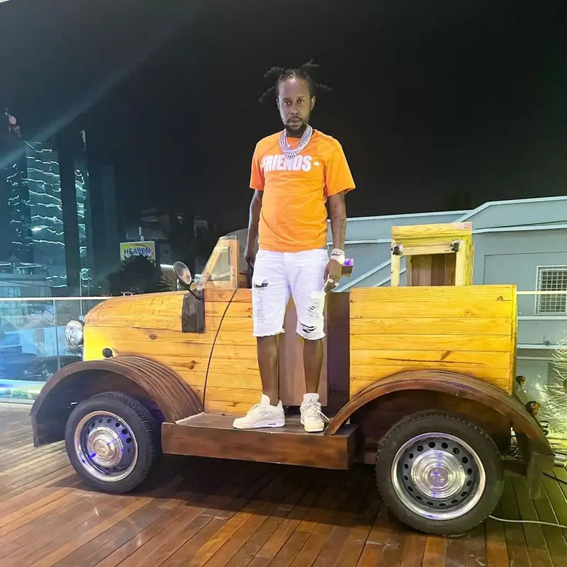 Popcaan outfit in Vlone, Jordan, and Burberry, 2022