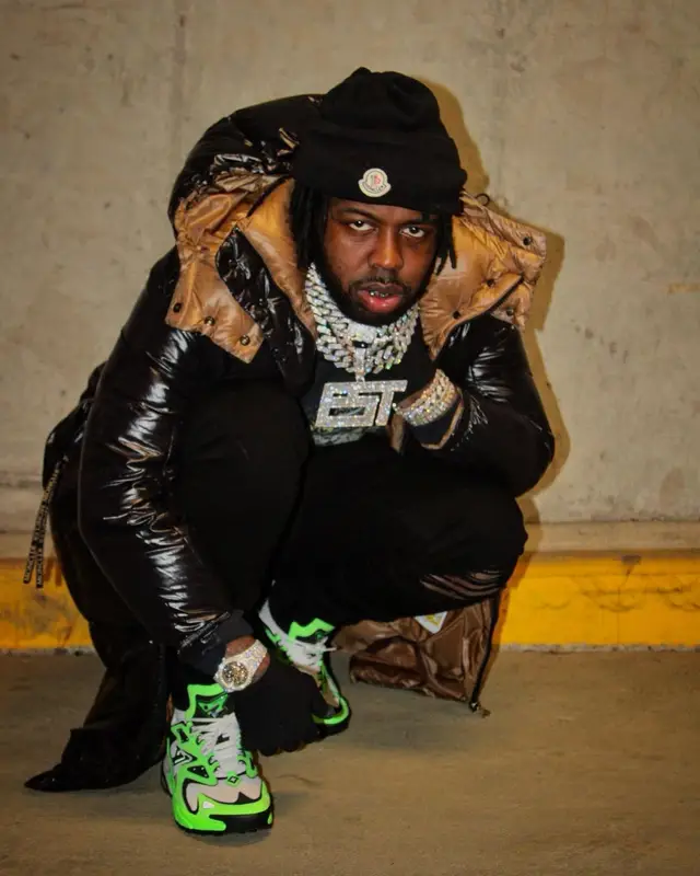 EST Gee outfit in Amiri, Louis Vuitton, and Moncler, 2022