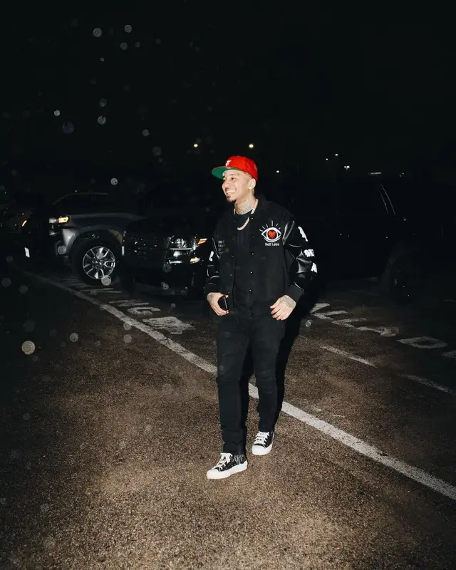 Kirko Bangz outfit in Dior, Fear of God, and New Era, 2022