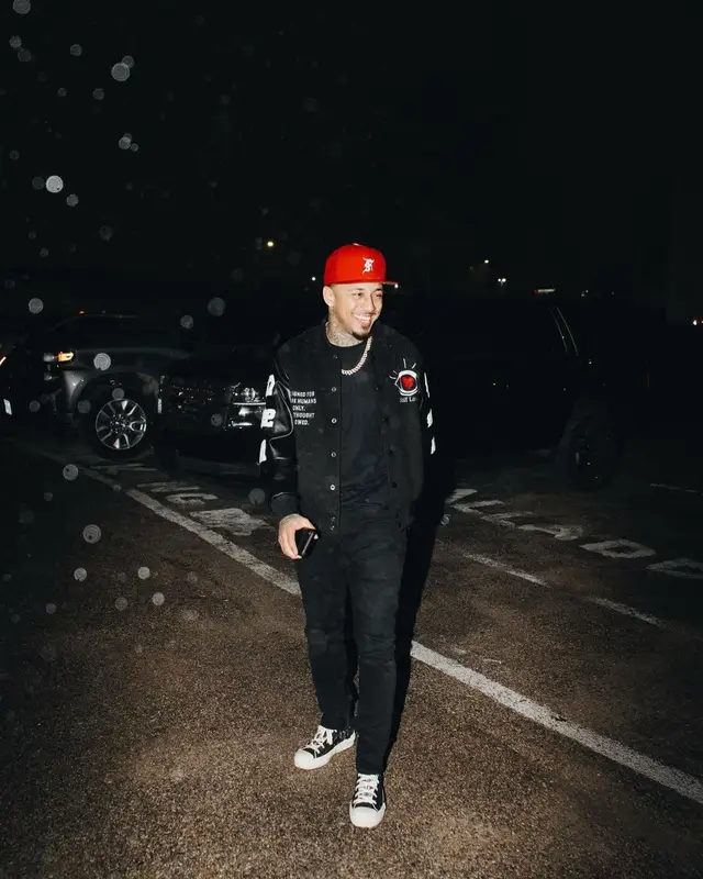 Kirko Bangz outfit in Dior, Fear of God, and New Era, 2022