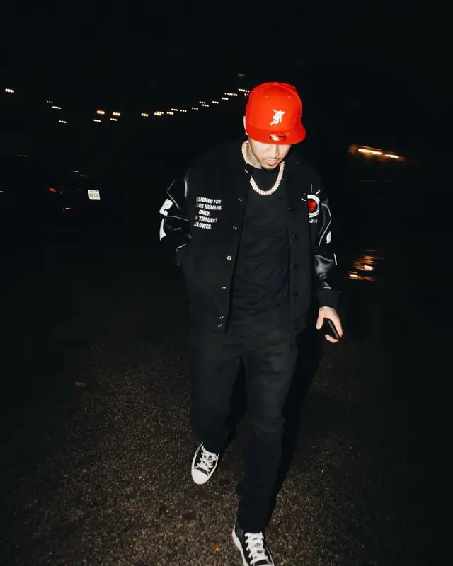 Kirko Bangz outfit in Dior, Fear of God, and New Era, 2022
