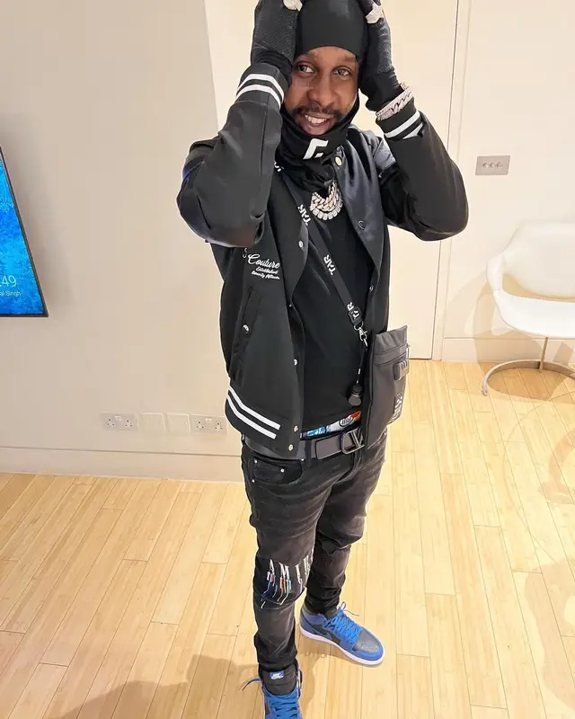 Popcaan outfit in The Couture Club, Amiri, and Valentino, 2022