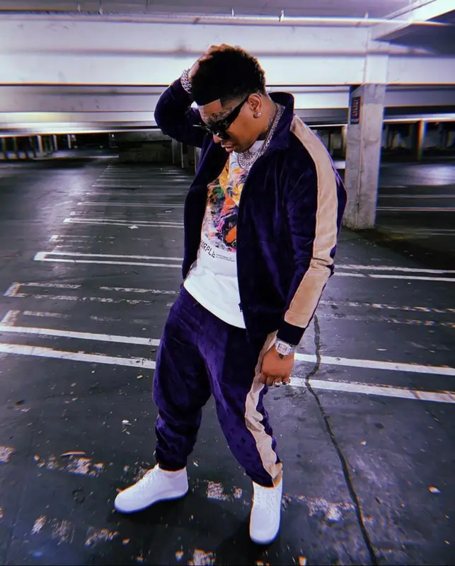 Lil Gotit outfit in OVO, Purple Brand, and Louis Vuitton, 2022