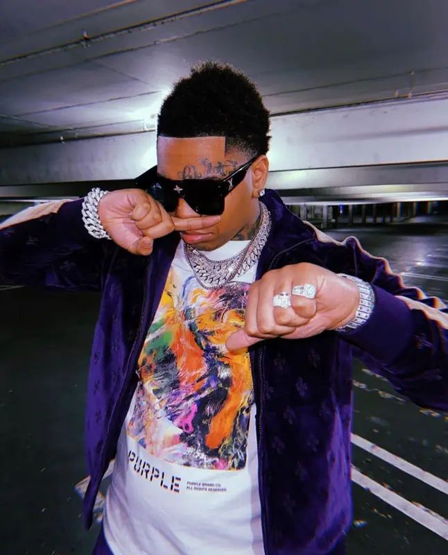 Lil Gotit outfit in OVO, Purple Brand, and Louis Vuitton, 2022
